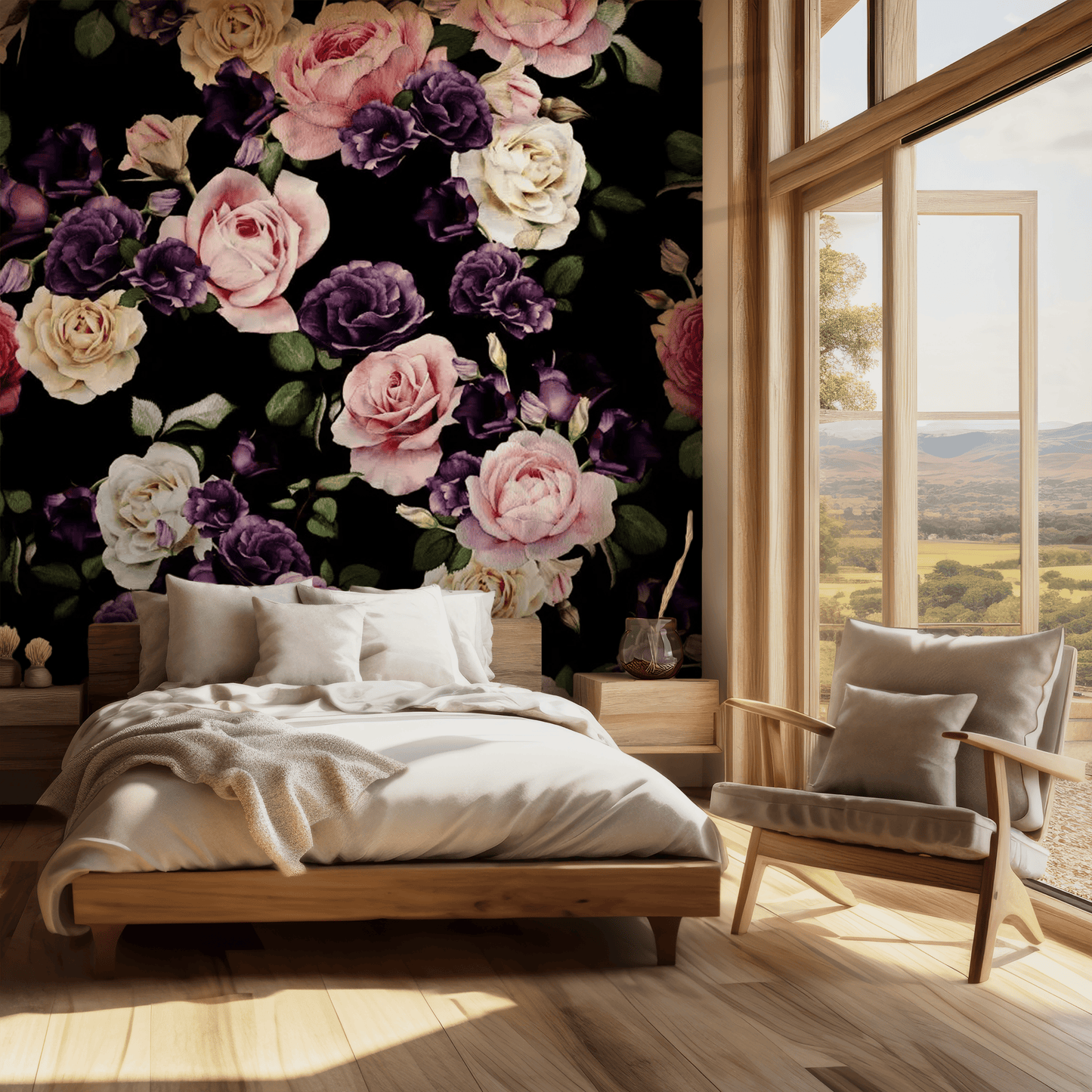 A bedroom with the Pink Garden Meadow Mural covering one wall, featuring a black background with pink flowers, beside a wooden bed frame and a armchair facing a large window with a view of a scenic landscape.