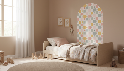 Children's bedroom with a bed, toys, and a decorative wall panel.