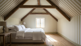 Warm yellow and cream vertical stripe wallpaper