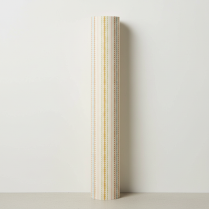 Roll of striped wrapping paper on a light gray background