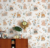 Close-up of bunny mural showing illustrated rabbits, floral accents, soft pastel colours, and high-quality wallpaper texture.