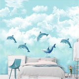 Blue dolphins in the clouds children's mural wallpaper for a kids' room