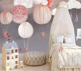 Pink and grey Nordic hot air balloon mural wallpaper for a nursery