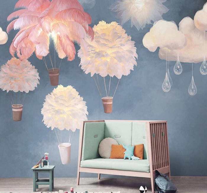 Multicoloured feather hot air balloon mural wallpaper in a nursery – pink and white balloons on a blue sky