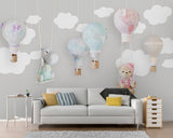 Grey and white clouds hot air balloon mural wallpaper in a nursery