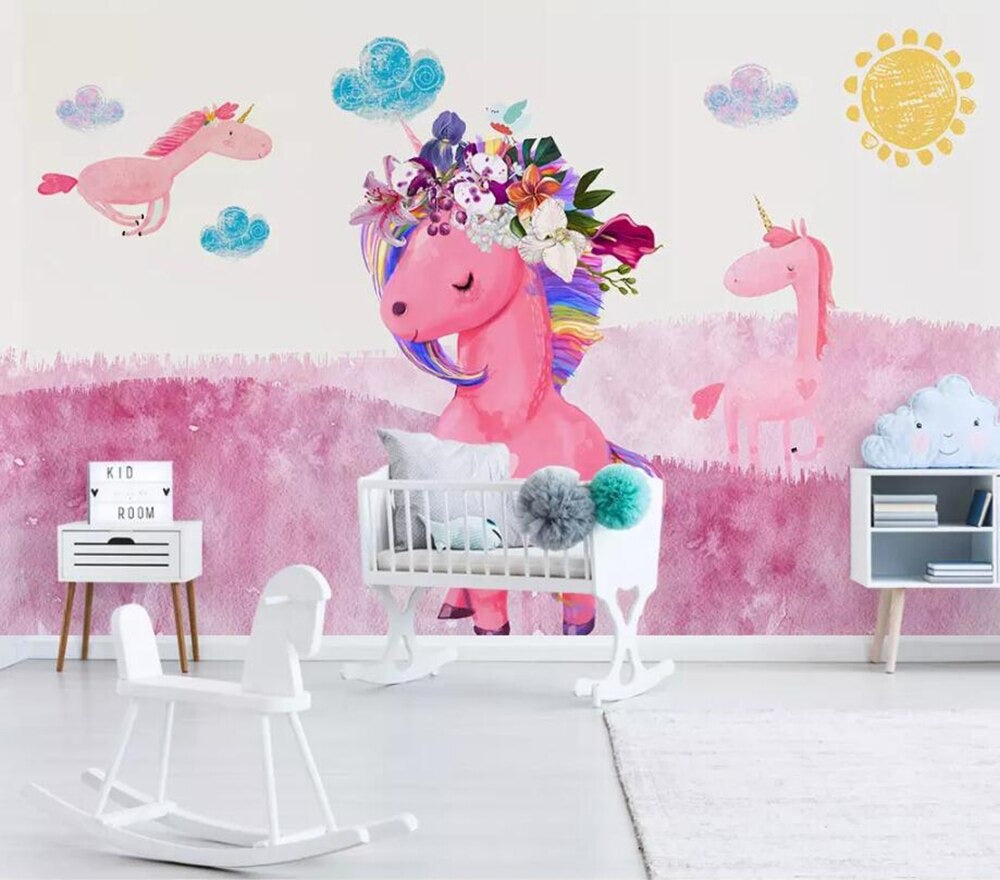 Girls pink floral unicorn mural wallpaper in a girls' bedroom – pink unicorns on an ombre sky