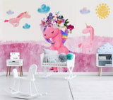 Girls pink floral unicorn mural wallpaper in a girls' bedroom – pink unicorns on an ombre sky