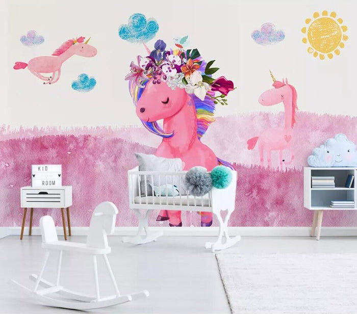Girls pink floral unicorn mural wallpaper in a girls' bedroom – pink unicorns on an ombre sky